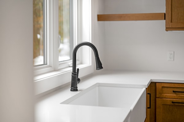 Modern black kitchen faucet close-up